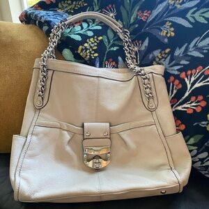 Beige colored B. Makowsky bag with silver hardware